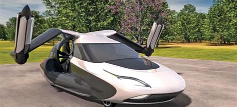 a futuristic car with open doors is parked in a parking lot next to ...