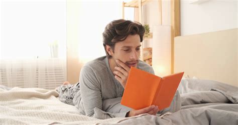 Man Reading Book In Bed Stock Footage SBV-337625400 - Storyblocks