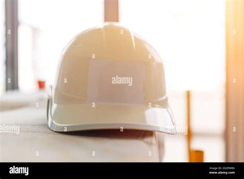 White Safety helmet at construction site Stock Photo - Alamy