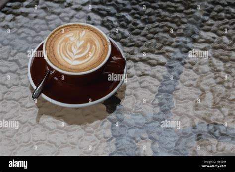 Hot coffee latte with beautiful latte art Stock Photo - Alamy