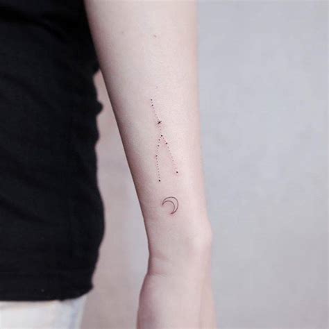 Taurus constellation tattoo on the wrist.