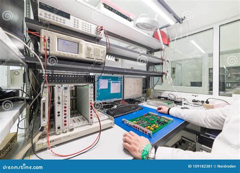 The Engineer Conducts a Test of the Finished Electronic Modules. Laboratory for Testing and ...