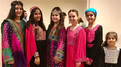 Women fight Taliban’s hijab mandate by posting pictures of colourful Afghan dresses on social ...