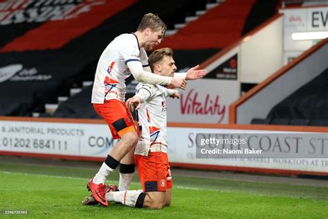 Kiernan Dewsbury-Hall of Luton Town celebrates with teammate Luke ...