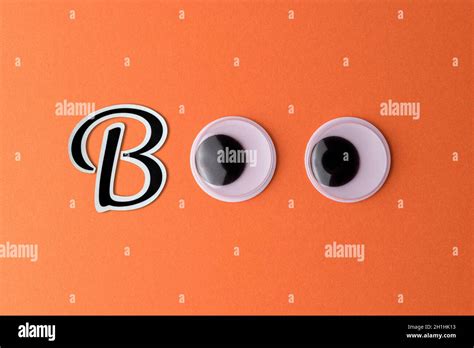 Word BOO made of black letter and googly eyes. Minimal Halloween concept Stock Photo - Alamy