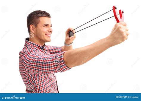 Cheerful Man Shooting a Slingshot and Smiling Stock Photo - Image of cheerful, firing: 59476190