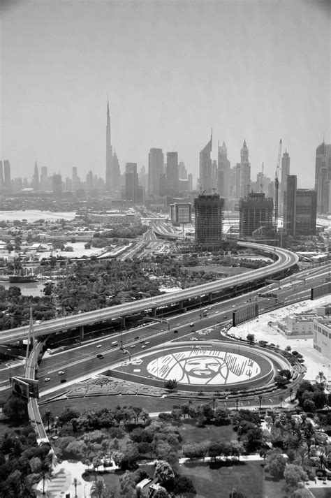 Monochrome Photograph of Roads Near Buildings in Dubai · Free Stock Photo