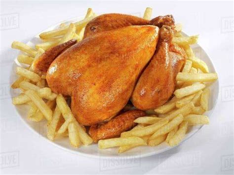 Roast chicken with chips - Stock Photo - Dissolve