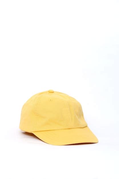 Premium Photo | Yellow baseball cap