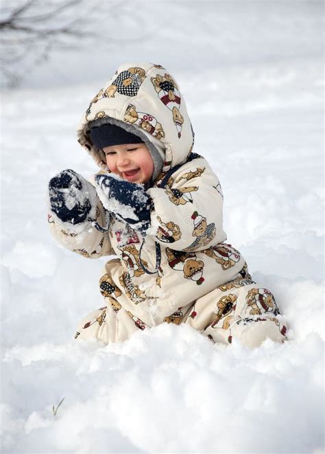 Happy Baby In Snow Stock Photos - Image: 12368483