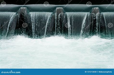 Close Up of a Manmade Concrete Weir in a City with a Blue River ...