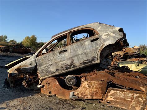 Cars Damaged in Fire on Junkyard. an Old Car Covered in Vines and Pinestraw Stock Image - Image ...