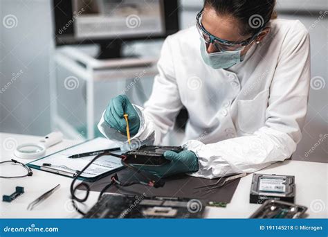 Forensic Science Technician Analyzing Evidence in Laboratory Stock Photo - Image of forensics ...