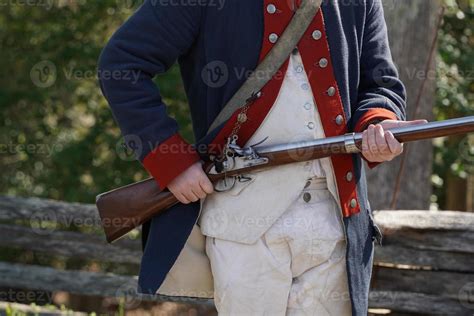 musket on hands of American Revolution british soldier settler in Yorktown, Virginia 22720254 ...