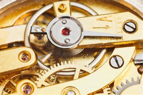 brass mechanical movement of retro watch 11924639 Stock Photo at Vecteezy