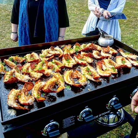 Outdoor cooking! Lobster pork chops mussels seafood all on the Blackstone Products Griddle ...