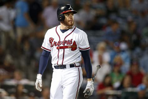 Atlanta Braves' Freddie Freeman walks back to the dugout after striking ...