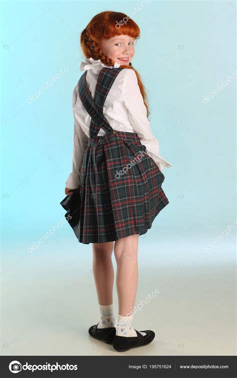 Beautiful Happy Little Redhead Girl Shows Her School Uniform Full Stock Photo by ©AntonioClemens ...