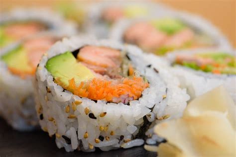 Salmon, Avocado and Carrot Sushi Roll Served on a Slate Plate with Ginger and Wasabi Stock Photo ...