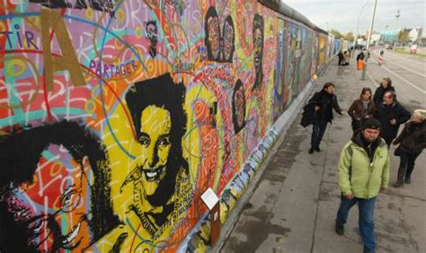 Two decades later, repainted murals on Berlin Wall celebrate freedom ...