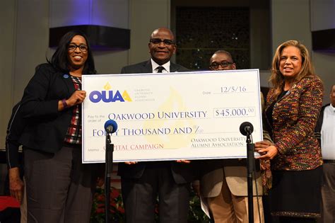 A check from representatives of the Oakwood University Alumni ...