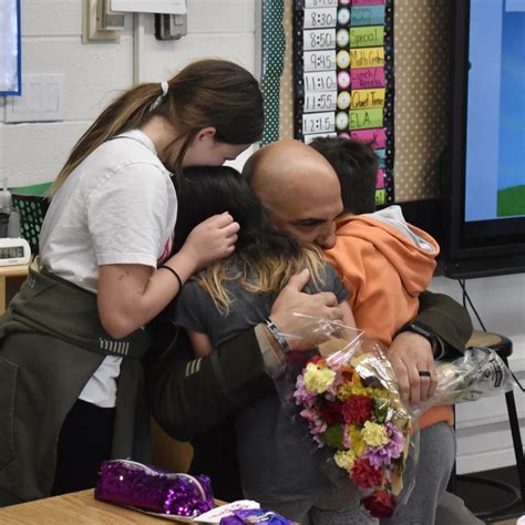 Children get surprise military homecoming from dad at their schools