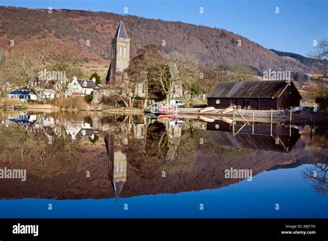 A mirror like reflection on the Lake of Menteith at Port of Menteith Stirlingshire Scotland ...