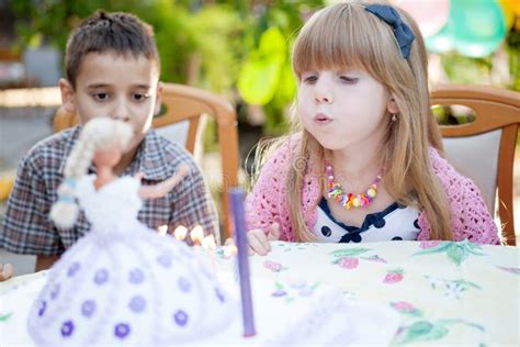 Kids Celebrating Birthday Party and Blowing Candles on Cake Stock Photo - Image of celebration ...