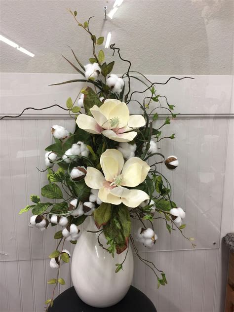 11117- cream magnolias in vase with cotton, curly willow and mixed greenery #weddi… | Large ...