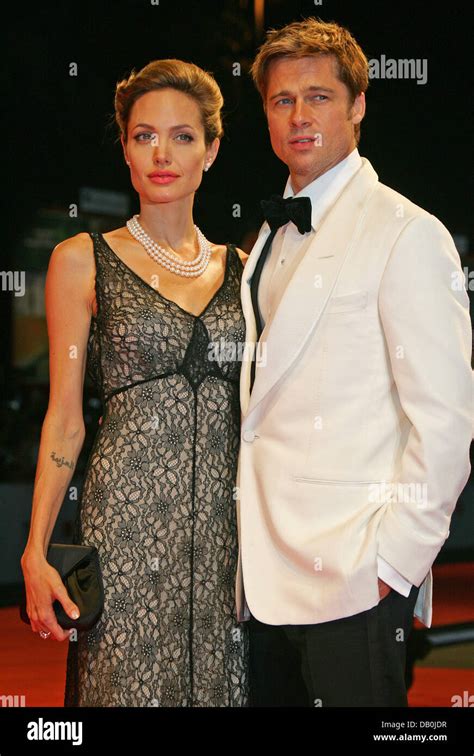 US actors Brad Pitt and Angelina Jolie pose as they arrive at the film ...