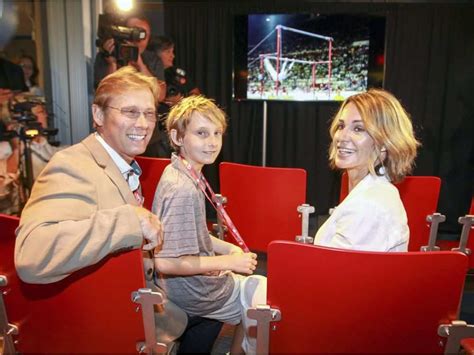 Nadia Comaneci with her husband Bart Conner and son Dylan stop to watch ...