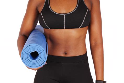 Fitness Woman With Abs Carrying Yoga Mat