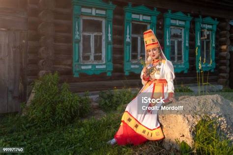 Cheerful Young Woman In Traditional Clothing Of Mari People Near ...