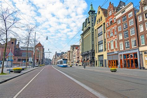 Damrak in Amsterdam - A Pretty and Popular Main Street in Amsterdam’s Centre - Go Guides