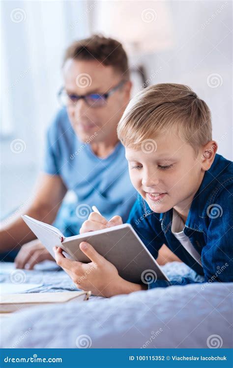 Charming Little Boy Writing in His Diary Stock Photo - Image of bedroom, parent: 100115352