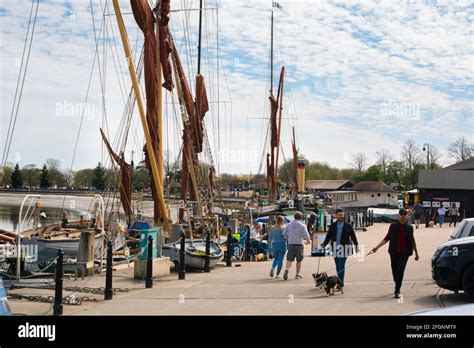 Maldon Essex UK, view of people walking beside barges along the ...