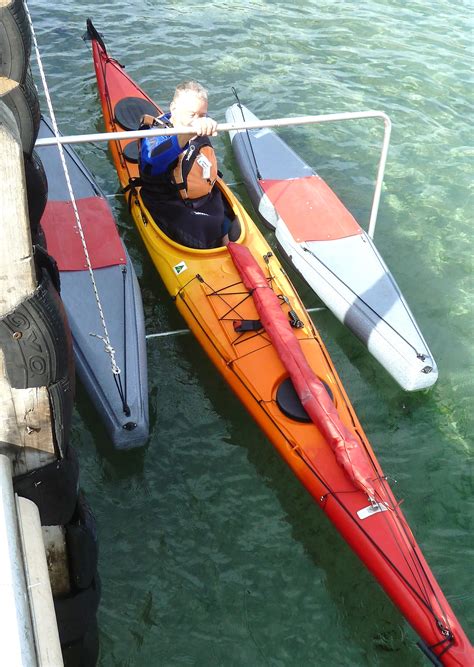 Floating kayak dock system for launching kayaks and canoes