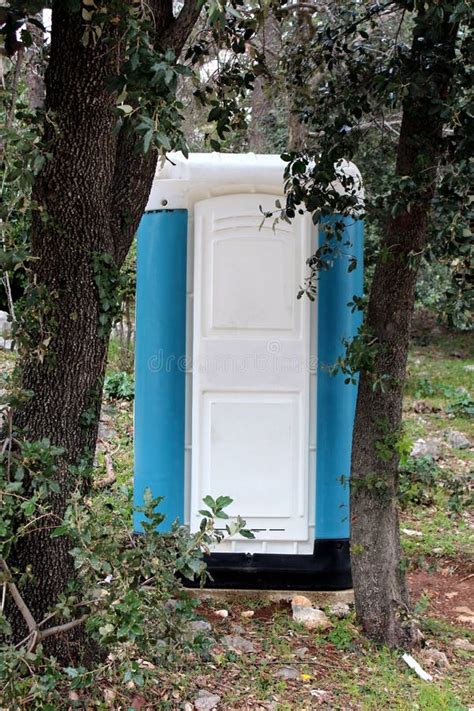 Portable Blue and White Ecological Toilet Behind Tall Trees Stock Photo - Image of trees, toilet ...