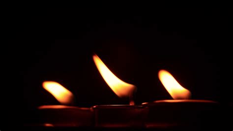 Candle flame on black background 5879438 Stock Video at Vecteezy