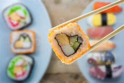 sushi with chopsticks 7745277 Stock Photo at Vecteezy