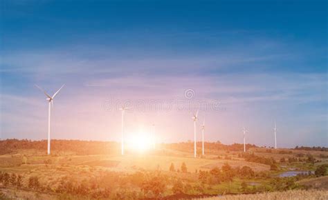 Wind Turbine Field with Blue Sky Background at Sunset Stock Image ...