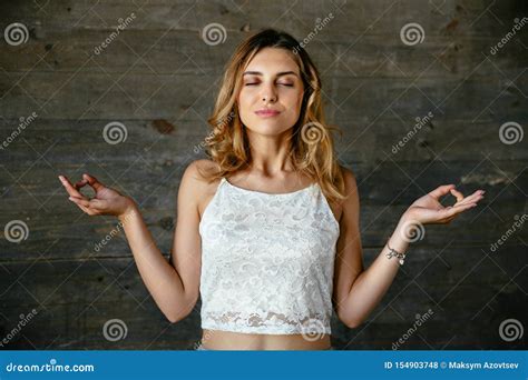 Beautiful Woman Meditates Closing Her Eyes Stock Photo - Image of silence, person: 154903748