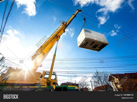 Mobile Crane Operating By Lifting And Moving An Heavy Electric G Stock Photo & Stock Images ...