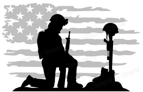 the silhouette of a soldier kneeling in front of an american flag