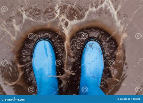 Autumn Mud Puddle Splash Fun Stock Photo - Image of funny, autumn: 59305346