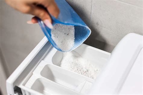 Pouring Washing Powder into The Washing Machine Free Stock Photo | picjumbo