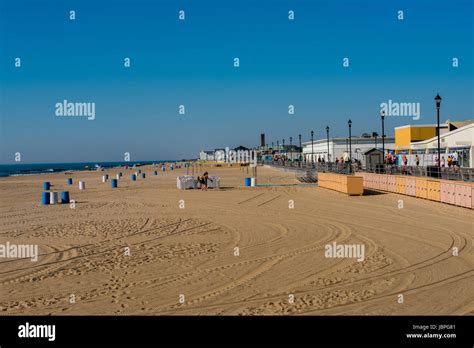 Asbury Park, NJ USA June 11, 2017 People on the beach at Asbury Park early on a Sunday morning ...