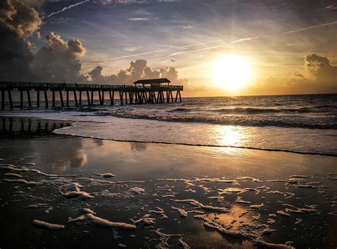 Sunrise at Tybee Island pier Photograph by Danny Mongosa