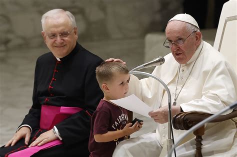 Young boy rushes stage to greet Pope Francis