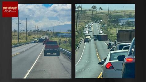 Crews quickly remove overturned semi-truck, trailer from Queen ...